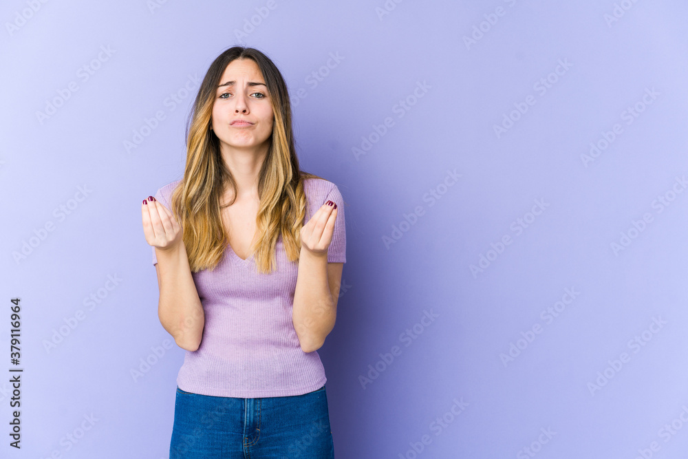 Young caucasian woman isolated on purple background showing that she has no money. Young caucasian woman isolated on purple background showing that she has no money.