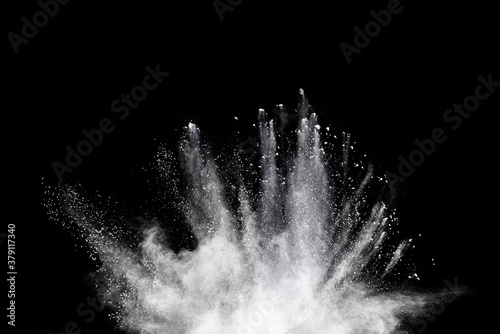 Explosion of white flour on black background.