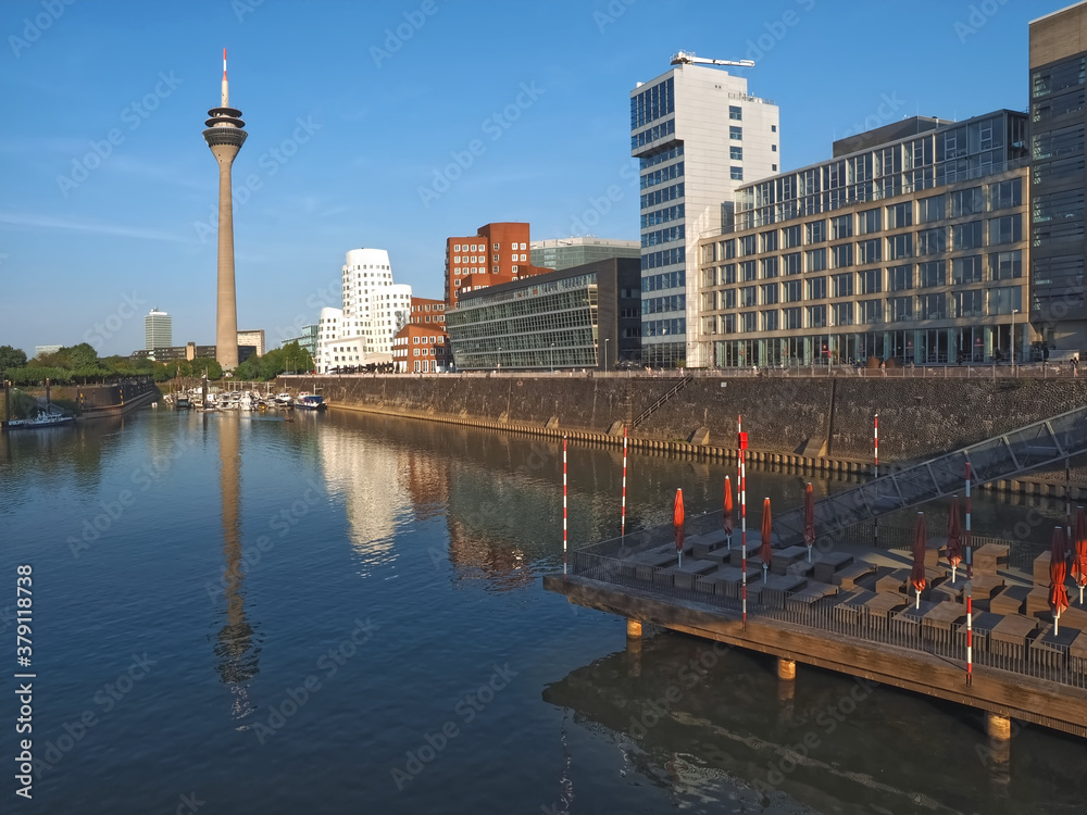 Obraz premium Television tower at the Media harbor in duesseldorf with facades and blue sky