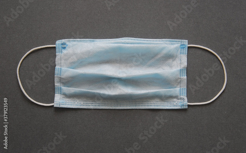 protective medical mask isolated on grey background, covid-19, coronavirus