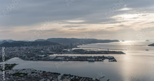 瀬戸内のタイムラプス映像 / 香川県　高松の街と夕焼けの空 photo