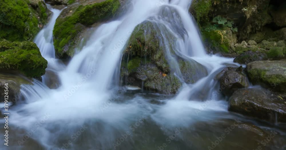 Stunning 4k Time-lapse video for waterfall running through rocks covered with green algae in tropical rainforest jungle in Natural Sassenage area at Grenoble France. Stunning 4k Time-lapse video for waterfall running through rocks covered with green algae in tropical rainforest jungle in Natural Sassenage area at Grenoble France.