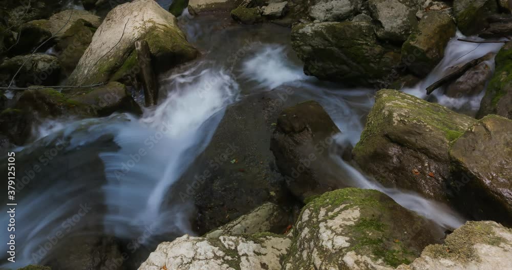 Stunning 4k Time-lapse video for waterfall running through rocks covered with green algae in tropical rainforest jungle in Natural Sassenage area at Grenoble France. Stunning 4k Time-lapse video for waterfall running through rocks covered with green algae in tropical rainforest jungle in Natural Sassenage area at Grenoble France.