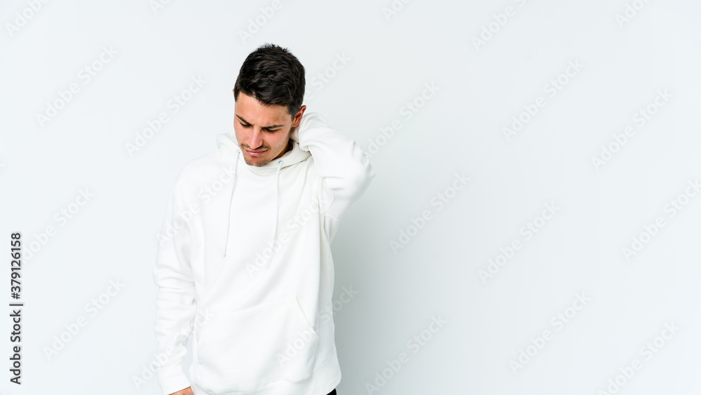 Young caucasian man isolated on white background suffering neck pain due to sedentary lifestyle. Young caucasian man isolated on white background suffering neck pain due to sedentary lifestyle.