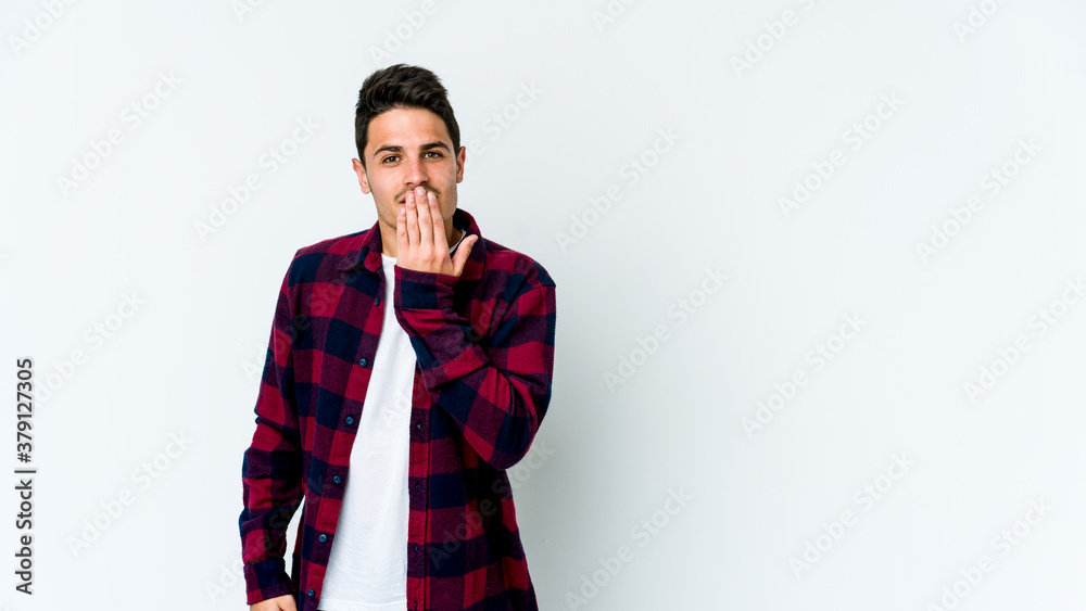 Young caucasian man isolated on white background shocked, covering mouth with hands, anxious to discover something new. Young caucasian man isolated on white background shocked, covering mouth with hands, anxious to discover something new.