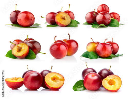 Colage mix set of fresh plum fruits with green leaves isolated on white background.