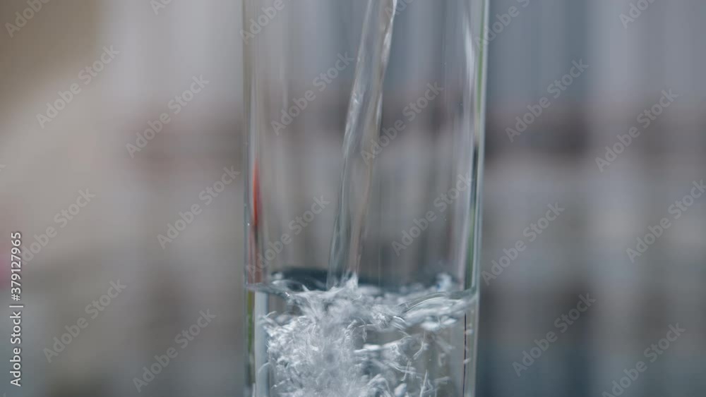 Close-up of a glass with clean drinking water, camera movement up Close-up of a glass with clean drinking water, camera movement up