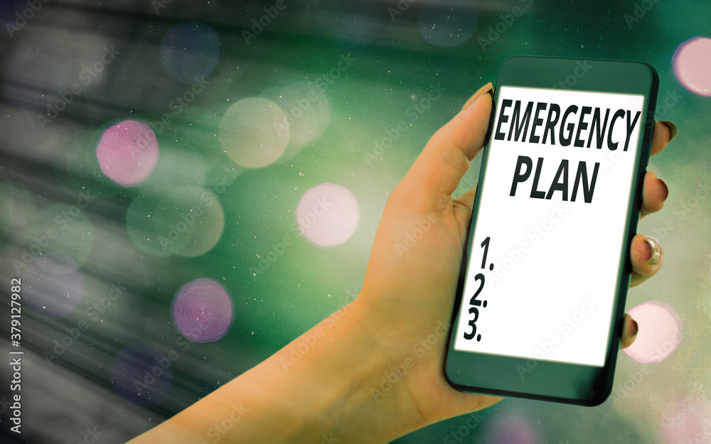 Conceptual hand writing showing Emergency Plan. Concept meaning procedures for handling sudden or unexpected situations Modern gadgets white screen under colorful bokeh background