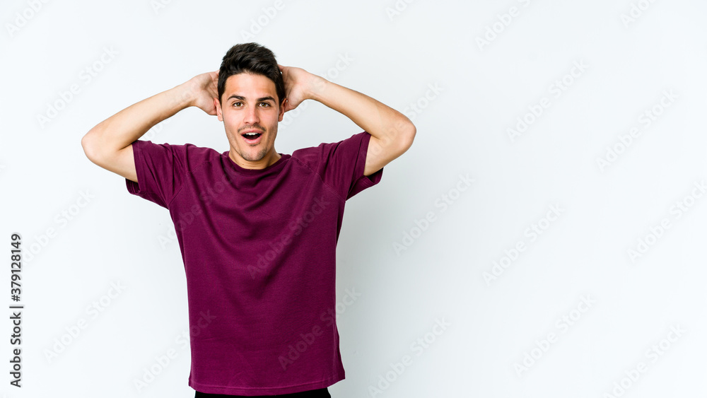 Young caucasian man isolated on white background screaming, very excited, passionate, satisfied with something.