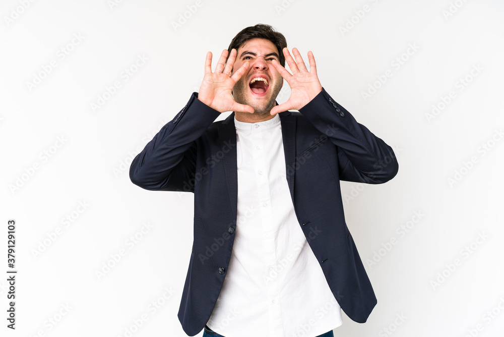 Young business man isolated on white background shouting excited to front. Young business man isolated on white background shouting excited to front.