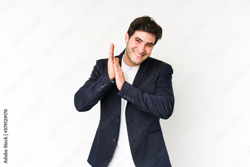 Young business man isolated on white background feeling energetic and comfortable, rubbing hands confident. Young business man isolated on white background feeling energetic and comfortable, rubbing hands confident.