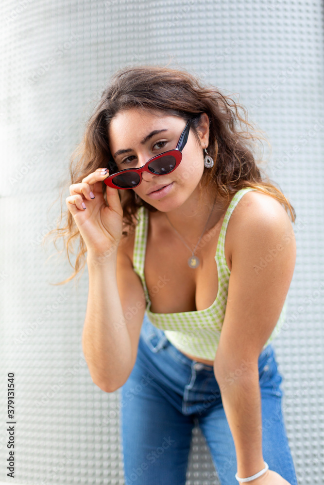 Portrait of young woman wearing sunglasses looking at camera Portrait of young woman wearing sunglasses looking at camera
