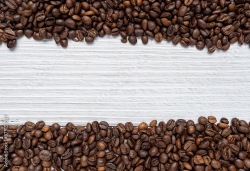 Arabika coffee beans background. Top view of Roasted Beans. copy space. food and drink concept.