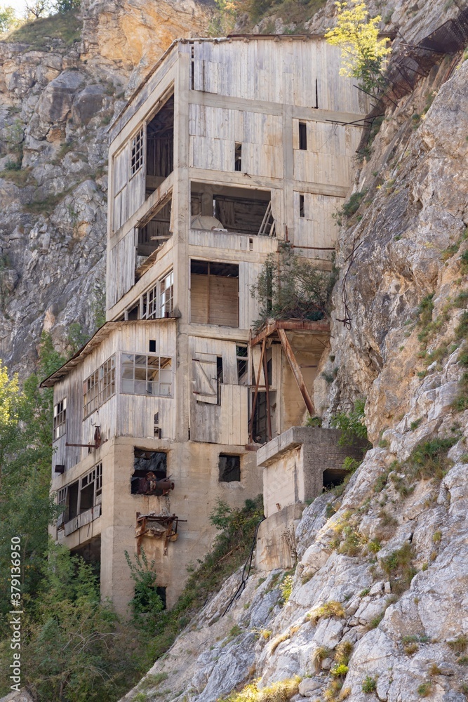 An old abandoned quarry on a slope of a mountain