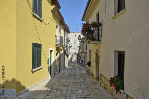 A narrow street among the old houses of San Marco dei Cavoti, a small town in the province of Benevento, Italy.