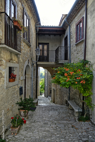 A narrow street among the old houses of San Marco dei Cavoti, a small town in the province of Benevento, Italy.