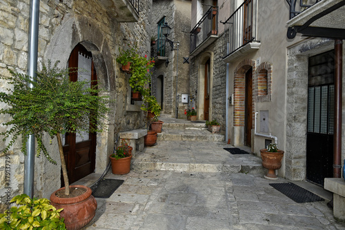A narrow street among the old houses of San Marco dei Cavoti  a small town in the province of Benevento  Italy.
