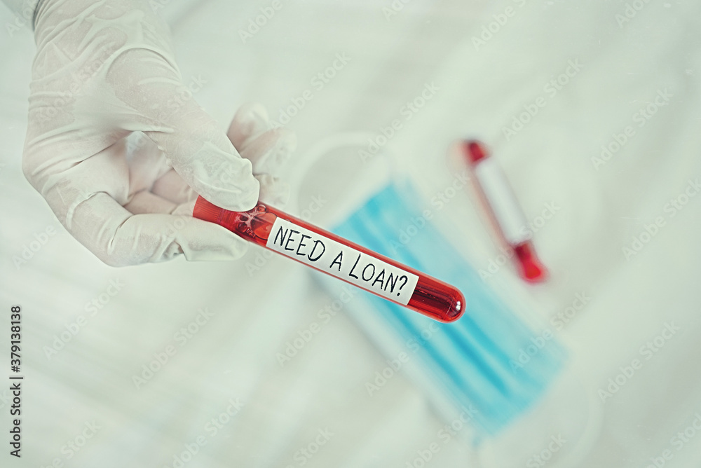Naklejka premium Text sign showing Need A Loanquestion. Business photo showcasing offering a money for an individualal or business finances Extracted blood sample vial ready for medical diagnostic examination