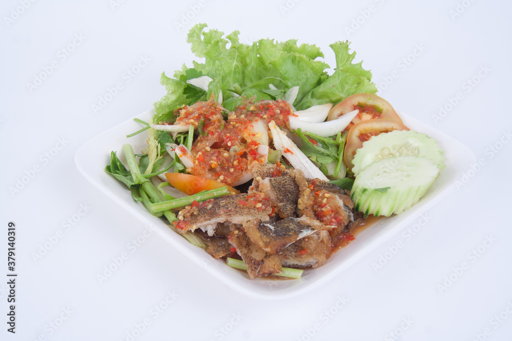 Chunks of crispy leaf fish in spicy dressing & fresh lemongrass Chunks of crispy leaf fish in spicy dressing & fresh lemongrass