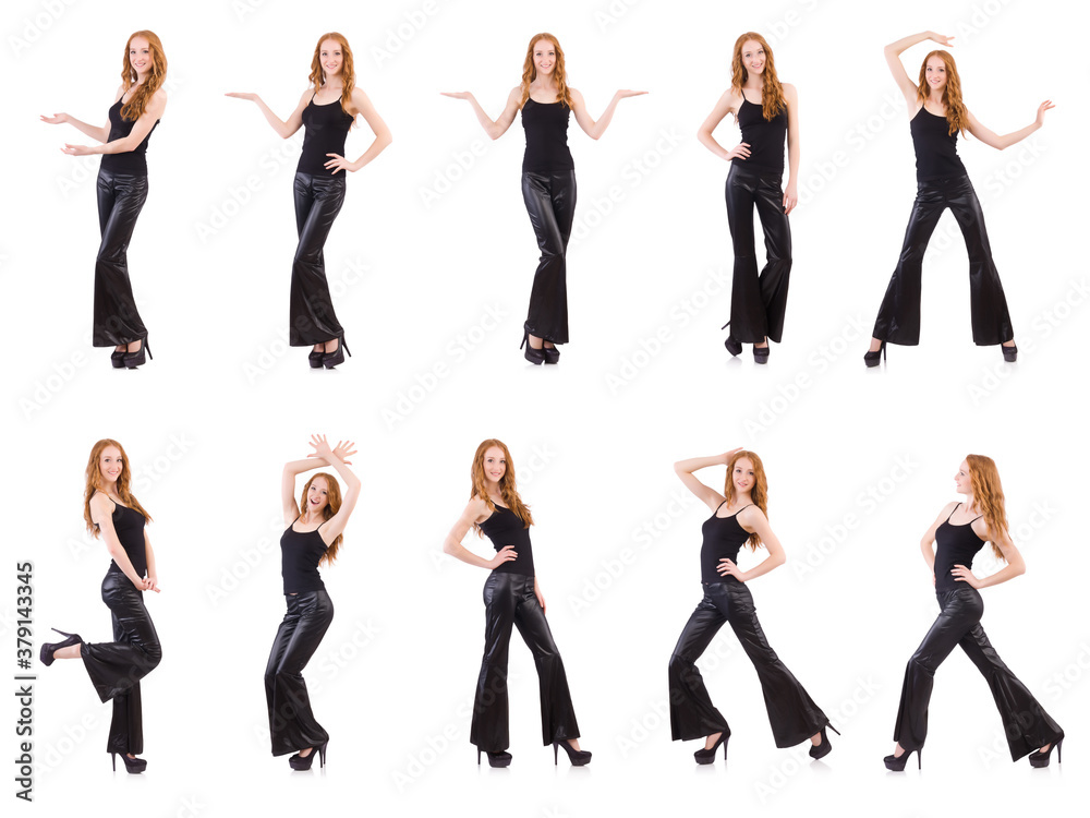 Fototapeta premium Redhead woman in black bell bottom pants on white