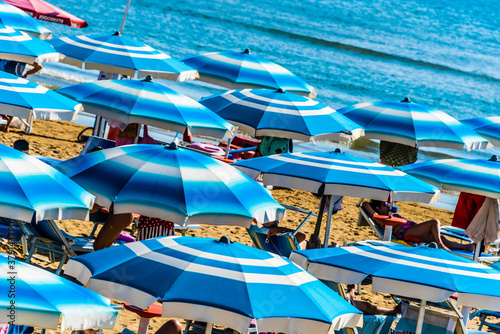 Umbrellas on the sandy sea beach