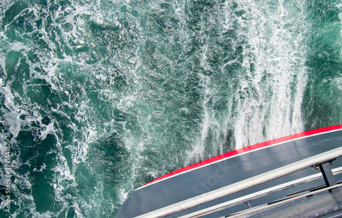 Panoramic ocean views from open promenade deck onboard luxury Cunard oceanliner or cruiseship or cruise ship liner over wash at sea cruising photo