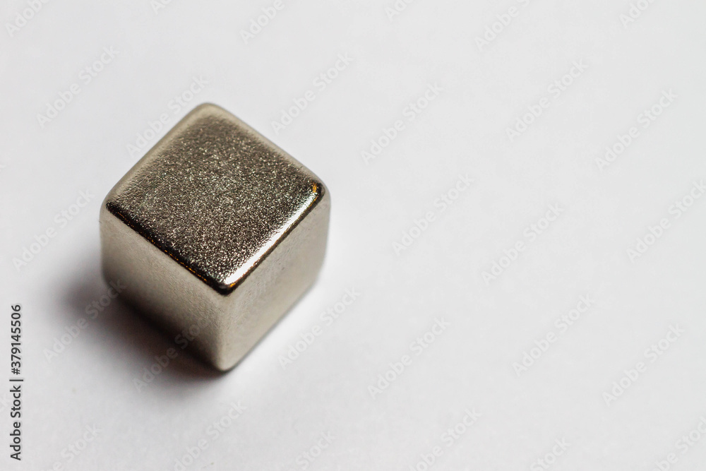 Steel magnetic cube on a white background. Steel magnetic cube on a white background.