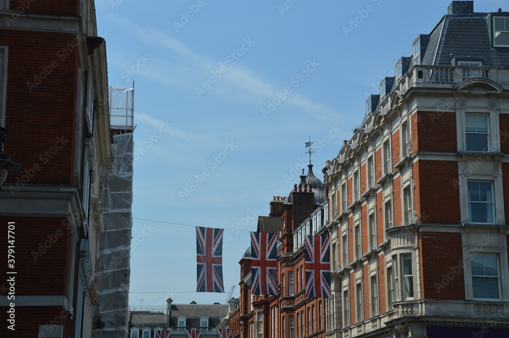 British flags hanging at a local street in London.