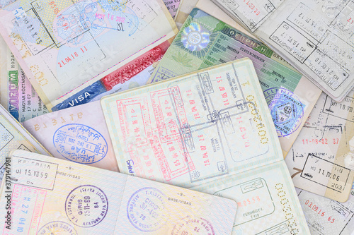 Pages of passports with different stamps and visas.