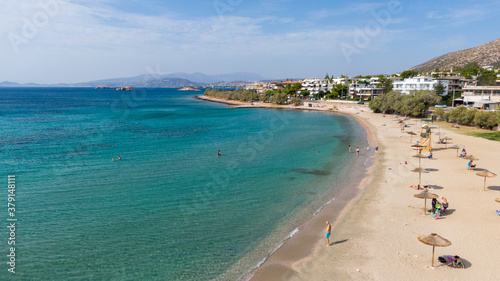 Fototapeta Naklejka Na Ścianę i Meble -  Aerial view of turquoise clear water and sandy beach of Ireon or Limni Vouliagmeni Lake in Peloponnese, Greece 