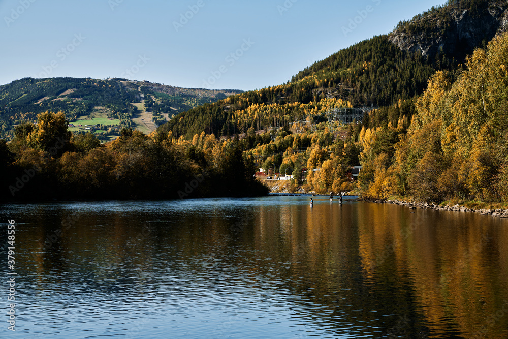 Fishermen at the river Hallingdalselva. The river that run though Hallingdal, Norway. Fishing in the autumn.