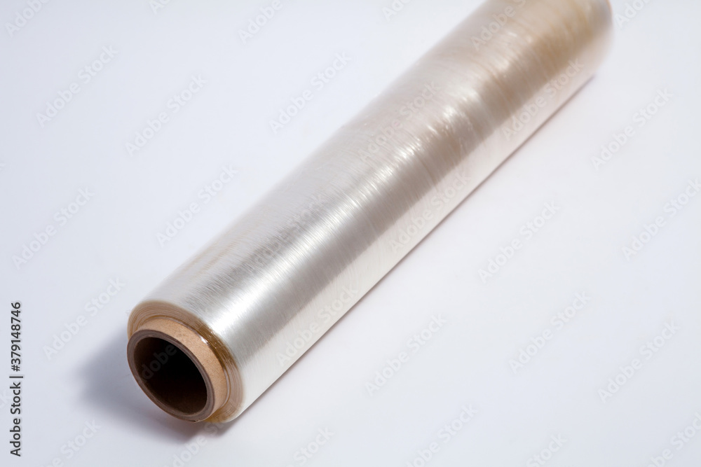 Packing with plastic stretch film on a white background. Packing with plastic stretch film on a white background.