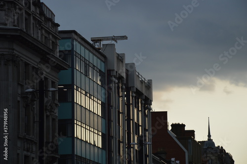A picture of buildings in the streets of London.