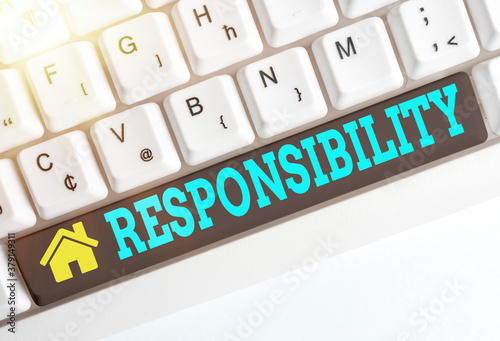 Text sign showing Responsibility. Business photo showcasing state of being responsible, something for one is responsible Different colored keyboard key with accessories arranged on empty copy space photo