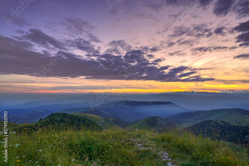 a sunset view from the top of mount grappa in Italy © marcobortignon