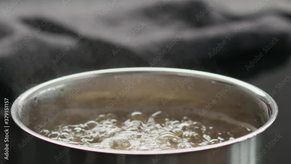 Slow motion closeup of boiling fusilli in a saucepan Slow motion closeup of boiling fusilli in a saucepan