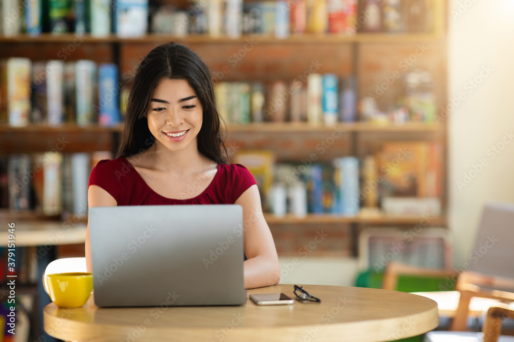 Remote Work Concept. Smiling Korean Woman Using Laptop In Cafeteria, Working Online Remote Work Concept. Smiling Korean Woman Using Laptop In Cafeteria, Working Online