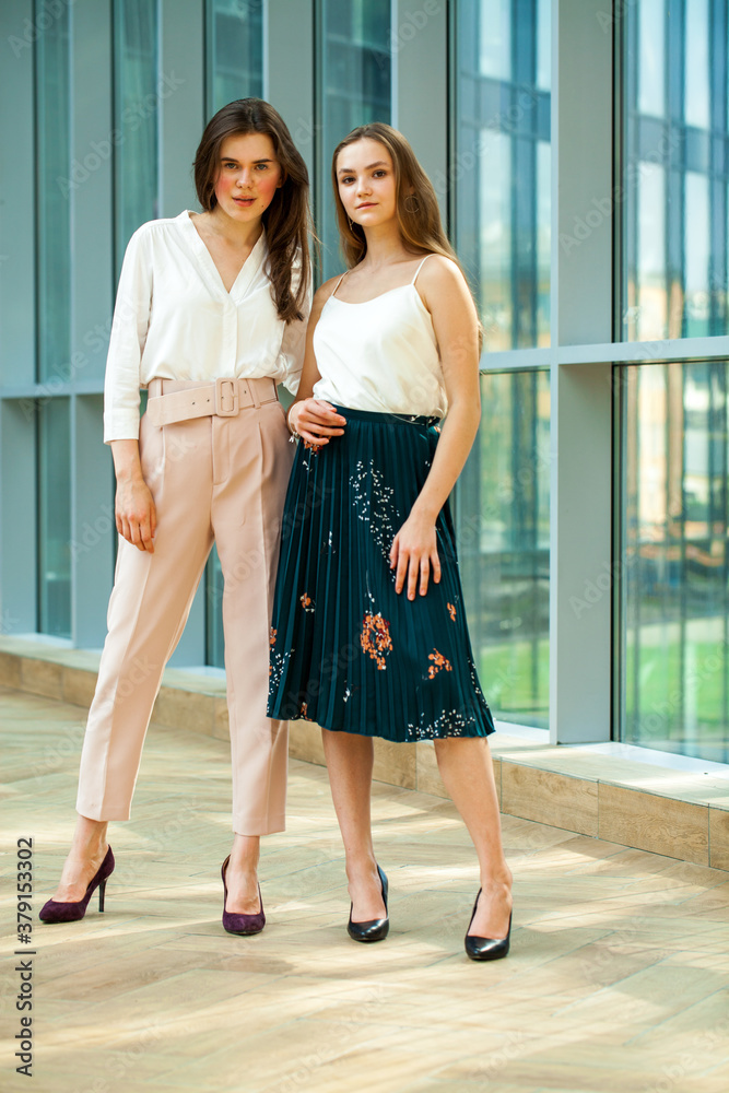 Portrait of two young business women