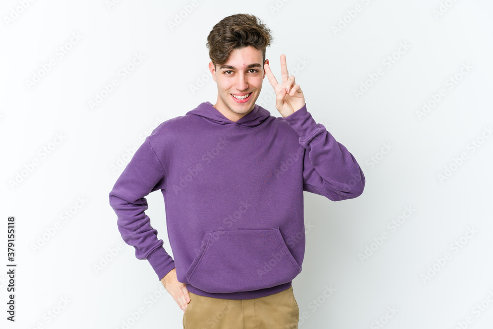 Young caucasian man isolated on white background showing number two with fingers. Young caucasian man isolated on white background showing number two with fingers.