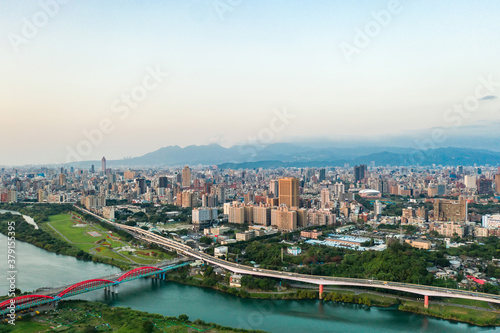 Taipei City Aerial View - Asia business concept image, panoramic modern cityscape building bird’s eye view under sunrise and morning blue bright sky, shot in Taipei, Taiwan