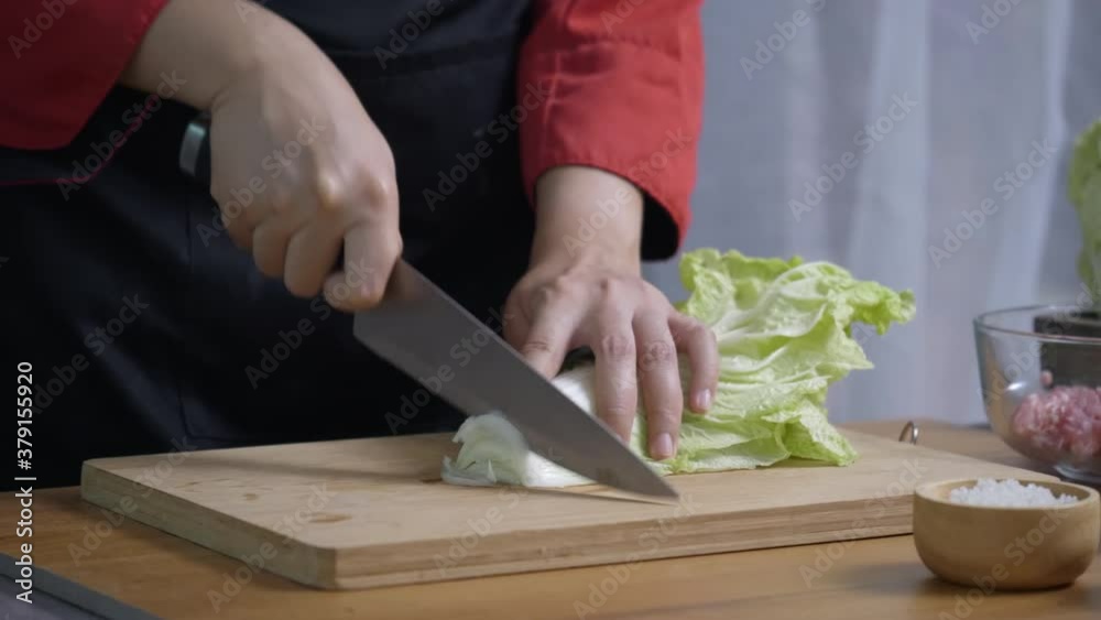 Cook was using knife to cut vegetable in the kitchen. Bring lettuce to use in cooking, making salad. Organic vegetable food business. Concept Vegetarian Diet. Cook was using knife to cut vegetable in the kitchen. Bring lettuce to use in cooking, making salad. Organic vegetable food business. Concept Vegetarian Diet.