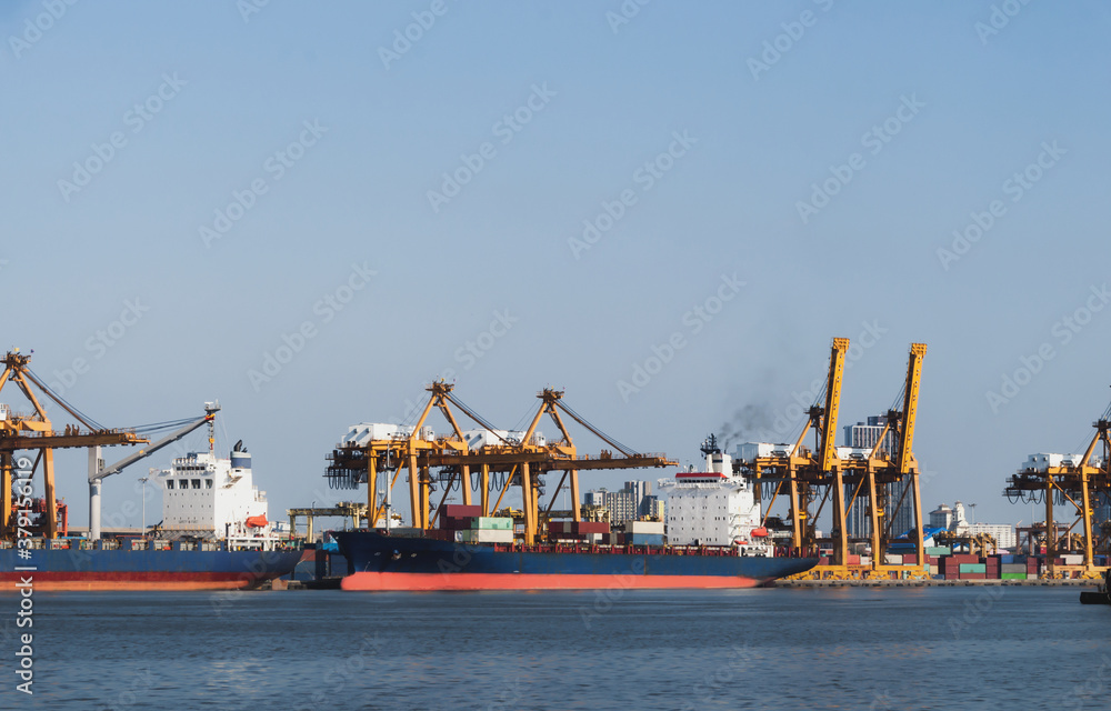 Logistics and transportation Container Cargo ship with tugboat in the ocean