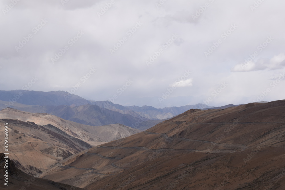 clouds over the mountains in Tanglang la Leh Ladakh clouds over the mountains in Tanglang la Leh Ladakh