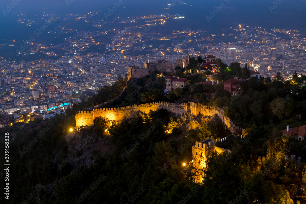 View from the height of the ancient fortress on the mountain in Alanya in Turkey in the evening illumination
