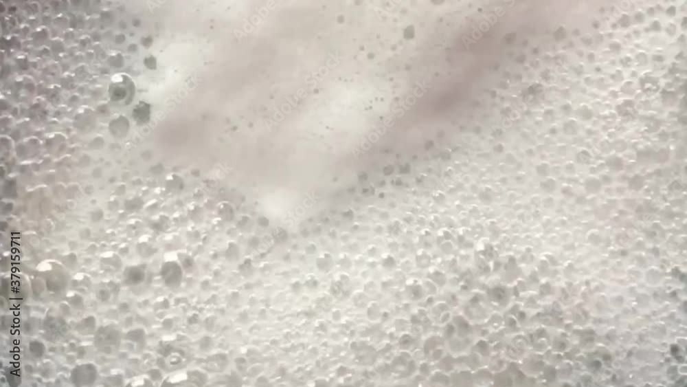 Close up overhead view of boiling , bubbly and foamy water Close up overhead view of boiling , bubbly and foamy water