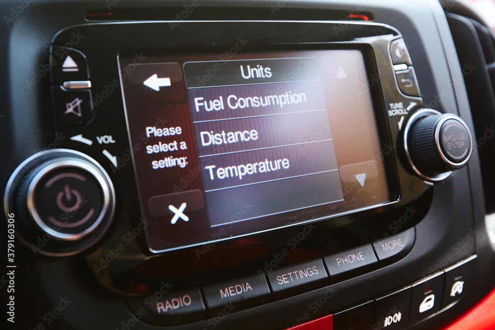 Menu and Select button on multimedia control panel of head unit in luxury car, automotive part concept. Menu and Select button on multimedia control panel of head unit in luxury car, automotive part concept.