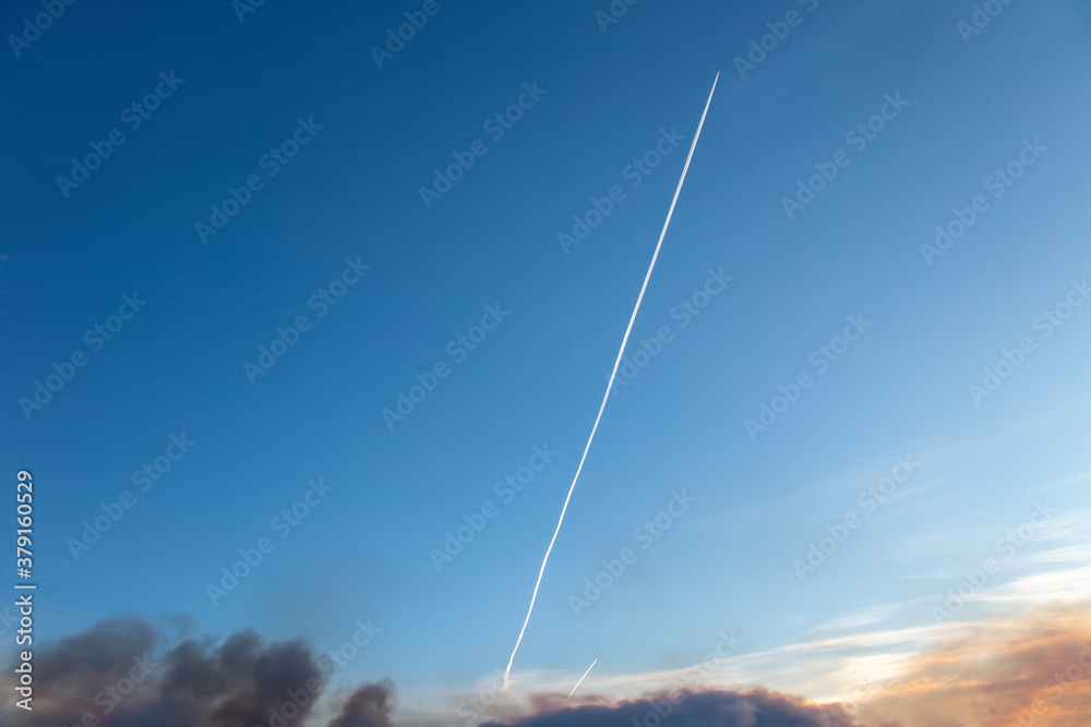 Airplane trail in blue sky with clouds. Airplane trail in blue sky with clouds.
