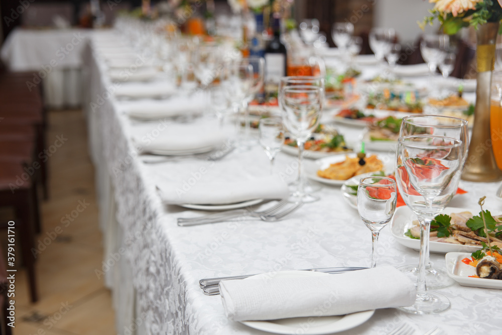 Table set for wedding or another catered event dinner. Table set for wedding or another catered event dinner.