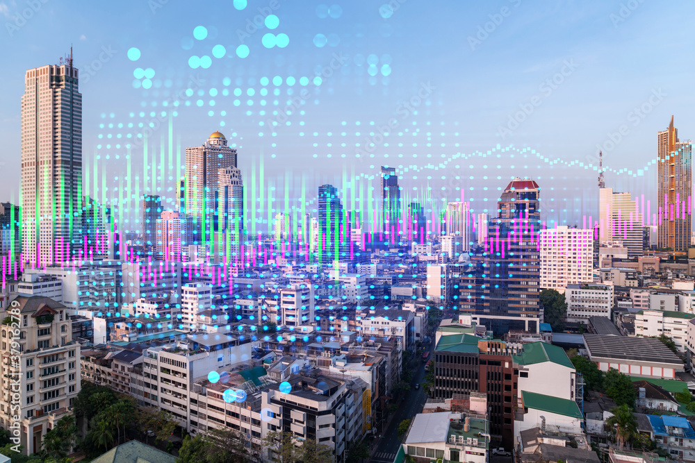 Fototapeta premium Financial stock chart hologram over panorama city view of Bangkok, business center in Asia. The concept of international transactions. Double exposure.