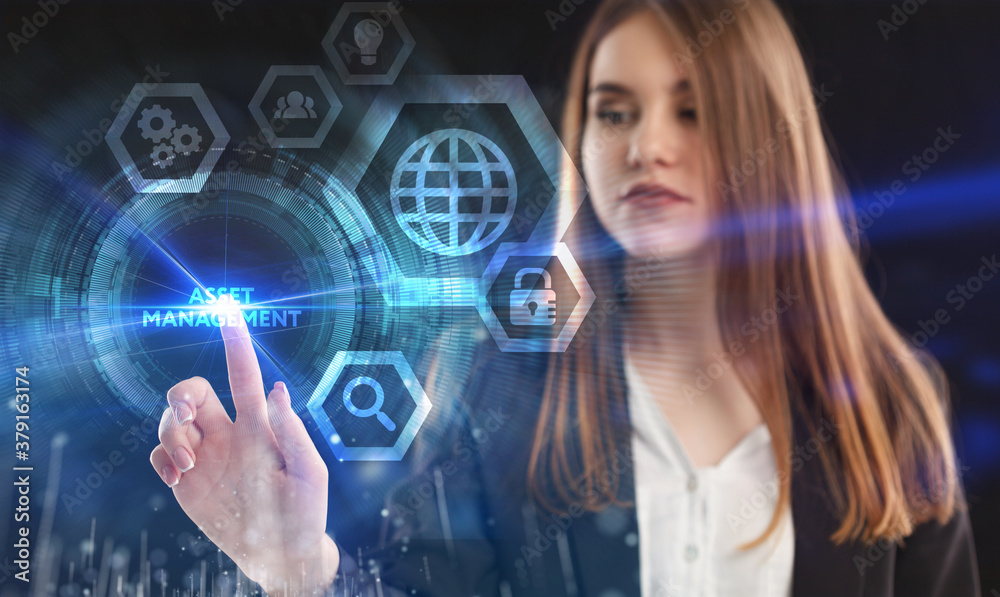 Business, Technology, Internet and network concept. Young businessman working on a virtual screen of the future and sees the inscription: Asset management Business, Technology, Internet and network concept. Young businessman working on a virtual screen of the future and sees the inscription: Asset management